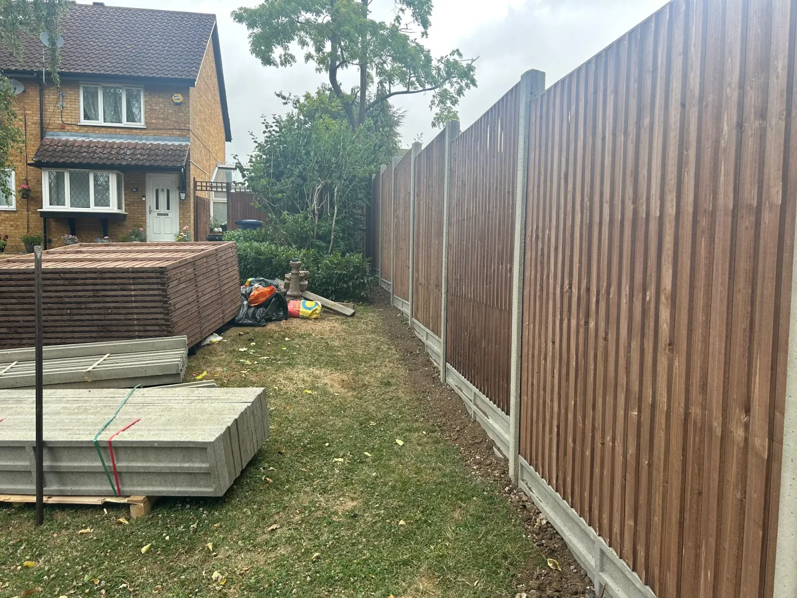 Fence posts set in concrete to 2 ft depth