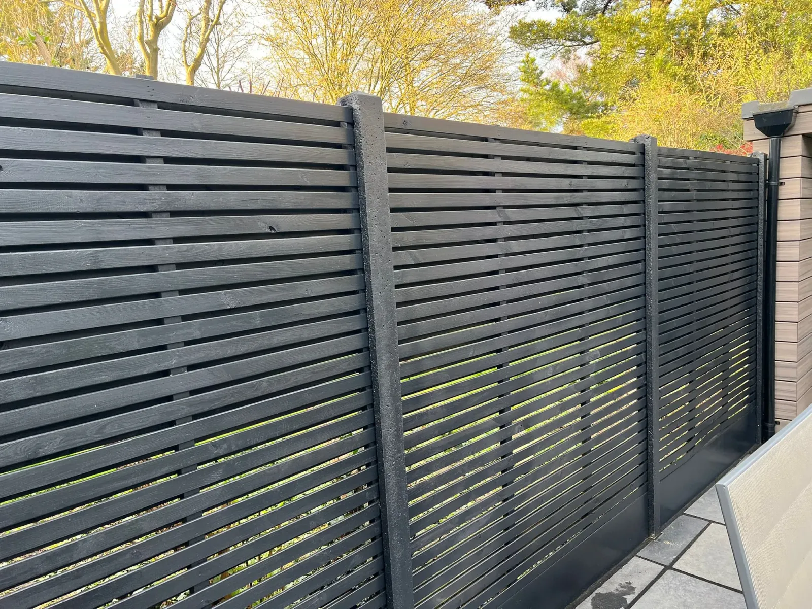 After: Chelsea Premium Square trellis panels above black-painted close-board fence